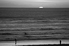 Black & White Sun Setting Behind Pacific Ocean preview