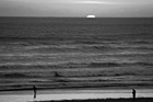 Black & White Sun Setting Behind Pacific Ocean preview
