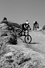 Black & White Kid Riding Bike Down a Hill preview