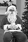 Black & White Close Up of Santa Sitting in Chair preview