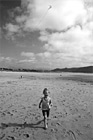 Black & White Little Girl Running on Beach with Kite preview